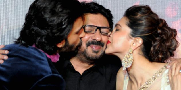 Indian Bollywood film actors Ranveer Singh (L) and Deepika Padukone attend their first look trailer launch of the upcoming romantic-drama Hindi film 'Ram Leela' directed and produced by Sanjay Leela Bhansali in Mumbai on September 16, 2013. AFP PHOTO (Photo credit should read STR/AFP/Getty Images)