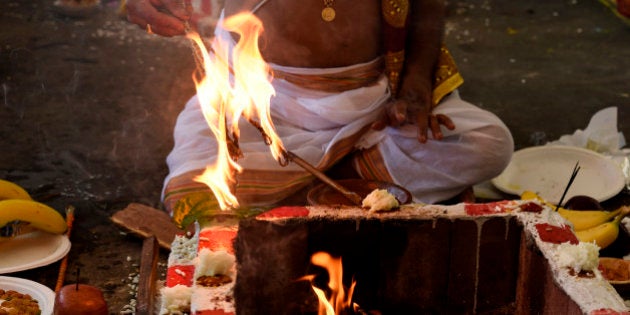 CENTENNIAL , CO - JUNE 7: Hindu priest Gkrishnan Ganapathy, who came from Fremont, CA, takes part in the Havan ritual ceremony during the grand opening ceremony of the Hindu Temple and Cultural Center in Centennial Colorado on June 7, 2015.The culturally rich ceremony also included the Murti Sthapana (diety installation) and the Prana Pratishtha (infusion of life) ceremonies with hundreds of local Hindus attending from around Colorado. (Photo By Helen H. Richardson/ The Denver Post)