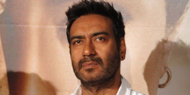 Indian Bollywood actor Ajay Devgn poses during the poster and song launch of the upcoming Hindi film 'Drishyam' directed by Nishikant Kamat in Mumbai on July 10, 2015. AFP PHOTO (Photo credit should read STR/AFP/Getty Images)