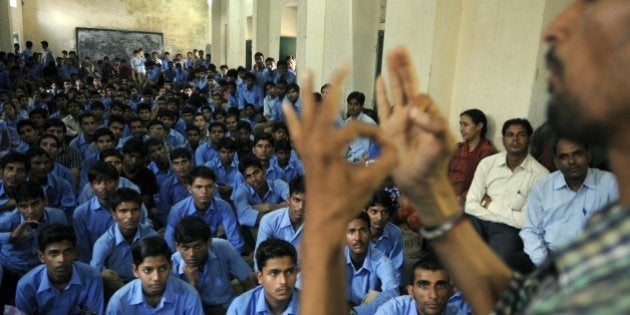 JAIPUR, INDIA - SEPTEMBER 5: A teacher interprets the Teachers' Day speech of Indian Prime Minister Narendra Modi for hearing and speech impaired students in sign language Seth Anandilal Poddar Deaf And Dumb Institute on September 5, 2014 in Jaipur, India. Prime Minister Narendra Modi interacted with millions of young students from across the nation in an unprecedented gesture on Teachers Day through satellite link and live telecast on Doordarshan and the human resource development ministry website. (Photo by Himanshu Vyas/Hindustan Times via Getty Images)