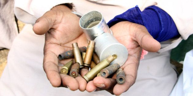 BATHINDA, INDIA - OCTOBER 20: A villager showing the shells of the cartridges fired by police during protest at Behbal Kalan on October 20, 2015 in Bathinda, India. The cops had allegedly fired over 100 rounds during the protest over the sacrilege of Guru Granth Sahib. Punjab is on the boil due to series of incidents of sacrilege of scriptures of Guru Granth Shib at seven places in the past one week which led to protests by Sikh organisations who blocked traffic at various places. (Photo by Sanjeev Kumar/Hindustan Times via Getty Images)