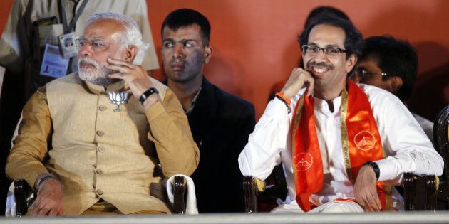 MUMBAI, INDIA - APRIL 21: BJP prime ministerial candidate Narendra Modi (L) with Shiv Sena party chief Uddhav Thackeray during an election rally at MMRDA ground, BKC on April 21, 2014 in Mumbai, India. The main opposition parties of Maharashtra i.e Sena-BJP-RPI have cobbled out grand alliance or Maha-Yuti against ruling Congress-NCP. (Photo by Kunal Patil/Hindustan Times via Getty Images)