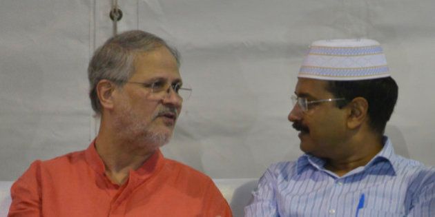 NEW DELHI, INDIA JULY 12: Arvind Kejriwal with Lieutenant Governor Najeeb Jung during an Iftar party hosted by him at New Delhi on Sunday evening.(Photo by Pankaj Nangia/India Today Group/Getty Images)