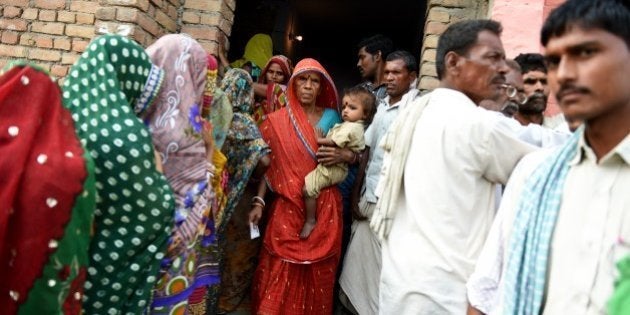 An Indian voter leaves after casting her ballot in the village of Banbira in Samstipur district on October 12, 2015. The first of five phases of voting in the state assembly elections in Bihar, one of India's largest and poorest states, begins on October 12. AFP PHOTO / MONEY SHARMA (Photo credit should read MONEY SHARMA/AFP/Getty Images)