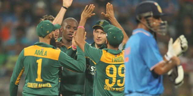 South African players celebrate the wicket of Indiaâs Axar Patel, during the final one-day international cricket match of a five-game series in Mumbai, India, Sunday, Oct. 25, 2015. (AP Photo/Rafiq Maqbool)