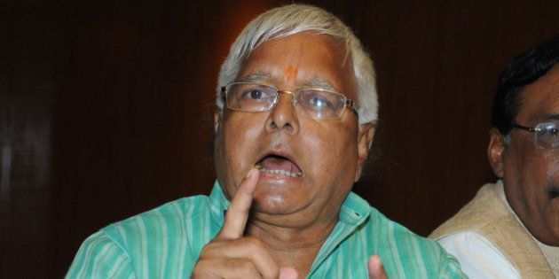 PATNA, BIHAR, INDIA - OCTOBER 8: RJD Chief Lalu Yadav addresses a press conference along with JD (U) and Congress leaders on October 8, 2015 in Patna, India. RJD Chief Lalu Prasad today challenged Prime Minister Narendra Modi to prove that he had made the 'shaitan' (devil) on his tongue comment or else seek apology from the people of Bihar for insulting them through this barb on him. (Photo by AP Dube/Hindustan Times via Getty Images)