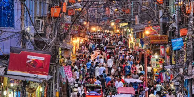 A street full of people near Jama Masjid in Old Delhi, Delhi, India. Electricity wiring in Old Delhi is a mess.