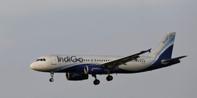In this Thursday, April 16, 2015 photo, India's budget airline IndiGo approaches for landing at the Indira Gandhi International (IGI) Airport in New Delhi, India. (AP Photo/Altaf Qadri)