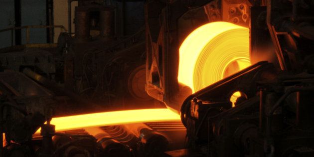 Hot orange steel rolling process in a steel manufacturing industry. Hot rolling is a metalworking process used mainly to produce sheet metal or simple cross sections, such as rail tracks. Other typical uses for hot rolled metal includes truck frames, automotive wheels, pipe and tubular, water heaters, agriculture equipment, compressor shells, rail car components, wheel rims, metal buildings, railroad-hopper cars, doors, shelving, discs, guard rails, automotive clutch plates.