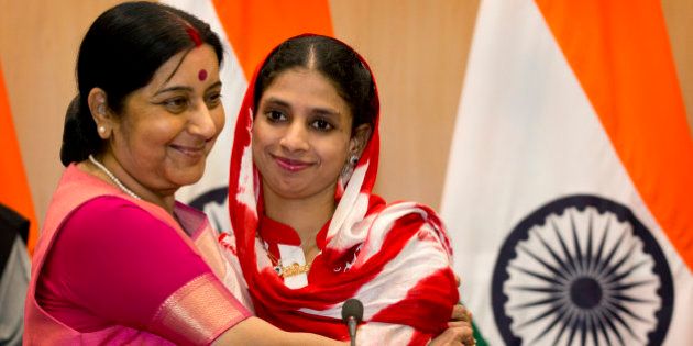 India's External Affairs Minister Sushma Swaraj, left, hugs Geeta, 23, a deaf and mute Indian woman who accidentally strayed into Pakistan as a child 12 years ago, during a press conference in New Delhi, India, Monday, Oct. 26, 2015. More than a decade ago, Geeta was found by Pakistan border troops, alone and weeping, near the border. Since she could not explain where she had come from, she was presumed to be Pakistani. The army handed the girl to a well-known Pakistani charity that ran a number of homes for orphans. (AP Photo/Manish Swarup)