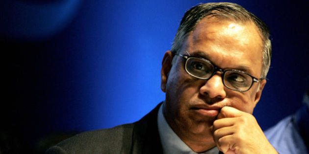 Bangalore, INDIA: The chairman and chief mentor of the India's second largest sofTware exporter firm, Infosys Technologies, N.R.Narayanamurthy gestures during the 25th Annual General Meeting of the company in Bangalore, 10 June 2006. Infosys was started in 1981 with a capital of US $250, and this year as the company is celebrating its 25th year, it has crossed the US $2 billion mark. AFP PHOTO/Dibyangshu SARKAR (Photo credit should read DIBYANGSHU SARKAR/AFP/Getty Images)