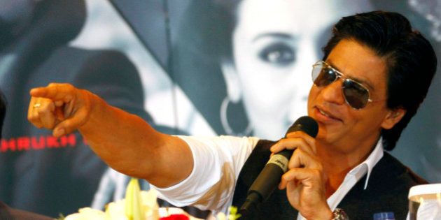 Bollywood actor Shah Rukh Khan gestures during a press conference ahead of his