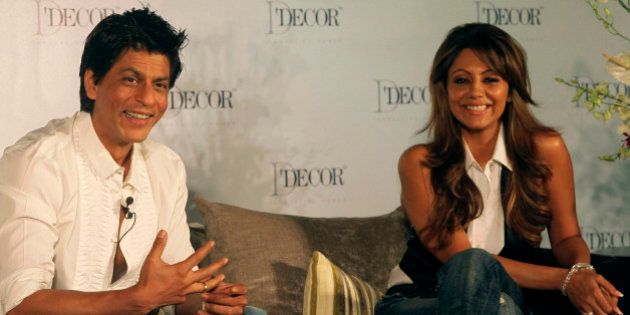 Bollywood actor Shah Rukh Khan, left, and his wife Gauri Khan look on during an event in Mumbai, India, Thursday, Aug. 26, 2010. (AP Photo/Rafiq Maqbool)