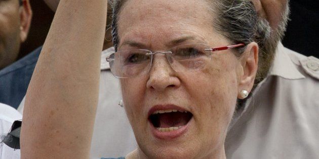 Indiaâs opposition Congress party president Sonia Gandhi shouts slogans against the government during a protest in the parliament premises, in New Delhi, India, Tuesday, Aug. 4, 2015. Tuesdayâs protest followed after the speaker of India's Parliament on Monday barred 25 opposition legislators from its sessions for the rest of the week for causing