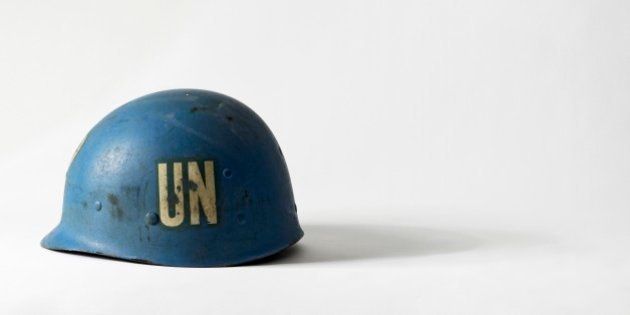 United Nations blue peacekeeper's helmet with the initials UN on side