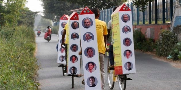 PATNA, INDIA - OCTOBER 19: Supporters of JD(U) on their cycle-raths carrying publicity material during election campaigning for Chief Minister of Bihar Nitish Kumar amid Bihar Assembly Elections, at Phulwari Sharif on October 19, 2015 in Patna, India. Bihar will hold five-phase elections between October 12 and November 5 to elect the 243-member assembly. Counting of votes will take place on November 8. (Photo by Arvind Yadav/Hindustan Times via Getty Images)