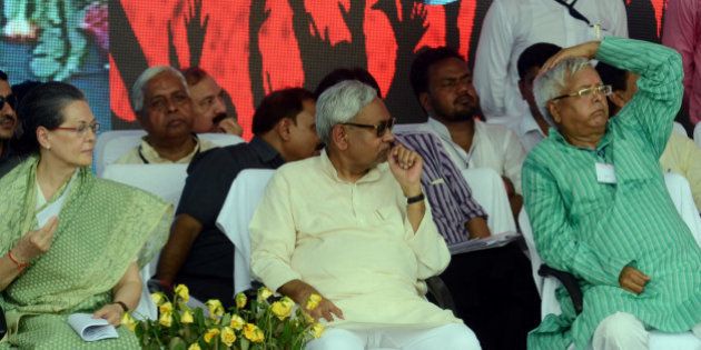 PATNA, INDIA - AUGUST 30: Congress President Sonia Gandhi with Bihar Chief Minister Nitish Kumar and RJD Chief Lalu Prasad during the Swabhiman rally at Gandhi Maidan, on August 30, 2015 in Patna, India. Gandhi attacked Modi on national level issues - his 'failure' to provide jobs to the youth, his 'anti-farmer' land bill, which he is now set to withdraw under Opposition from the Congress and the 'communal' agenda of the ruling BJP. (Photo by Santosh Kumar/Hindustan Times via Getty Images)