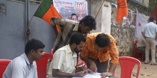 Party workers help voters identify their voting stations in Thiruvanathapuram, Kerala.The workers are stationed at least 200 metres away from polling stations, as per election commission regulations.Photo by Ranjit Bhaskar / Al Jazeera