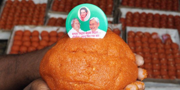 PATNA, INDIA - NOVEMBER 7: Special ladoos being made for Lalu Yadav and Nitish Kumar by the order of JDU leaders on the eve of Bihar election, on November 7, 2015 in Patna, India. RJD Chief Lalu Yadav said he was confident that his Rashtriya Janata Dal (RJD) and the JD-U combine will win 190 of the 243 seats in the Bihar assembly. Bihar voted in five phases starting in October and ending earlier this week; the results will be counted on Sunday. The five-phase polling in the state of Bihar ended on November 6. Official results will be announced on November 8. (Photo by AP Dube/Hindustan Times via Getty Images)