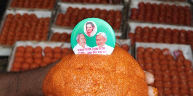PATNA, INDIA - NOVEMBER 7: Special ladoos being made for Lalu Yadav and Nitish Kumar by the order of JDU leaders on the eve of Bihar election, on November 7, 2015 in Patna, India. RJD Chief Lalu Yadav said he was confident that his Rashtriya Janata Dal (RJD) and the JD-U combine will win 190 of the 243 seats in the Bihar assembly. Bihar voted in five phases starting in October and ending earlier this week; the results will be counted on Sunday. The five-phase polling in the state of Bihar ended on November 6. Official results will be announced on November 8. (Photo by AP Dube/Hindustan Times via Getty Images)