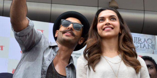 MUMBAI,INDIA SEPTEMBER 15: Ranveer Singh and Deepika Padukone at the launch from their upcoming move Bajirao Mastani in Mumbai.(Photo by Milind Shelte/India Today Group/Getty Images)
