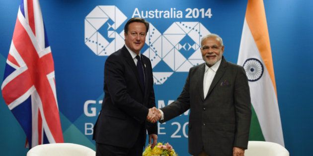 British Prime Minister David Cameron, left, shakes hands with Indian Prime Minister Narendra Modi during a bilateral meeting at the Brisbane Convention and Exhibitions Centre, ahead of the G-20 summit in Brisbane, Friday, Nov. 14, 2014. Brisbane is playing host to top officials from the 20 biggest industrialized and developing economies for a two day meeting from Saturday Nov.15. (AP Photo/Lukas Coch,Pool)