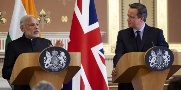 India's Prime Minister Narendra Modi (L) and British Prime Minister David Cameron give a joint press conference at the Foreign Office in London on November 12, 2015. India's Prime Minister Narendra Modi will meet Britain's Queen Elizabeth II and address a huge rally at London's Wembley Stadium during a three-day visit to Britain focused on trade and investment starting today. AFP PHOTO / NIKLAS HALLE'N (Photo credit should read NIKLAS HALLE'N/AFP/Getty Images)