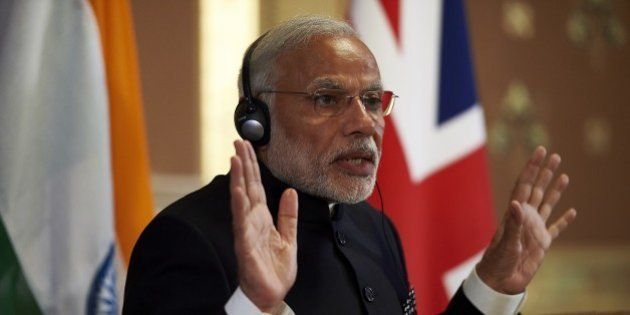 India's Prime Minister Narendra Modi takes part in a joint press conference with British Prime Minister David Cameron (not pictured) at the Foreign Office in London on November 12, 2015. India's Prime Minister Narendra Modi will meet Britain's Queen Elizabeth II and address a huge rally at London's Wembley Stadium during a three-day visit to Britain focused on trade and investment starting today. AFP PHOTO / NIKLAS HALLE'N (Photo credit should read NIKLAS HALLE'N/AFP/Getty Images)