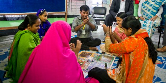 Gazipur, Bangladesh - October 07: German Development Minister Gerd Mueller meets with female textile workers and survivors of Rana-Plaza-Disaster in a Cafe project for women of German development organisation GIZ on October 07, 2015 in Gazipur, Bangladesh. (Photo by Michael Gottschalk/Photothek via Getty Images)