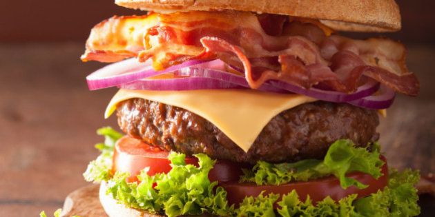 bacon cheese burger with beef patty tomato onion