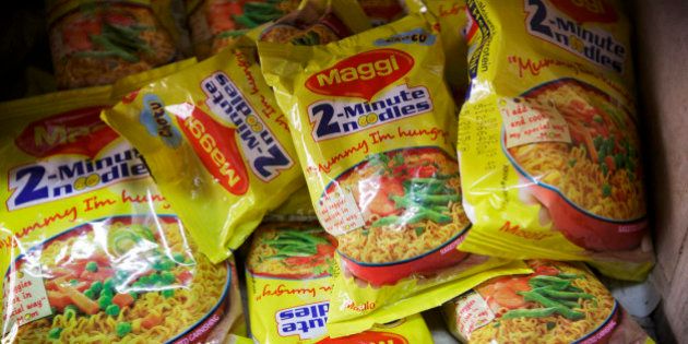 Packets of Maggi 2-Minute Noodles, manufactured by Nestle India Ltd., sit behind the counter at a store in New Delhi, India, on Monday, June 15, 2015. Nestle SA said the U.S. Food and Drug Administration is testing samples of imported Maggi noodles after the worlds largest food company halted sales in India when regulators said they contained unhealthy levels of lead. Photographer: Kuni Takahashi/Bloomberg via Getty Images