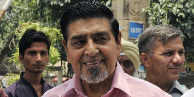 NEW DELHI, INDIA - MAY 31: Congress leader Jagdish Tytler leaves after appear at Patiala House court in a defamation complaint filed against him by a senior lawyer, appearing for victims in the 1984 anti-Sikh riot cases, on May 31, 2014 in New Delhi, India. Delhi court reserved for July 2 its order on whether charge of criminal intimidation is added against Congress leader Jagdish Tytler in a defamation complaint. (Photo by Mohd Zakir/Hindustan Times via Getty Images)