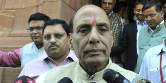 NEW DELHI, INDIA - MARCH 20: Union Home Minister Rajnath Singh talking to media personnel regarding Kathua terror attack on a Police Station during Budget Session of Parliament on March 20, 2015 in New Delhi, India. Upper House of Parliament passed the Mines and Minerals Development and Regulation (MMDR) Amendment Bill, 2015 (Photo by Vipin Kumar/Hindustan Times via Getty Images)