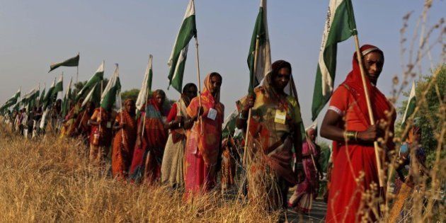 In this Tuesday, Oct. 9, 2012 photo, Indian landless farmer women march during the