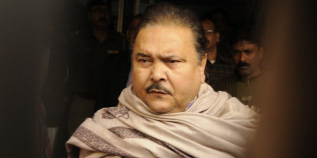 KOLKATA, INDIA - DECEMBER 13: Madan Mitra, West Bengal Transport Minister (Trinamool Congress) being taken to the Alipore court from the CBI office, at Saltlake on December 13, 2014 in Kolkata, India.. He has been arrested in connection with the multi-crore Saradha chit fund scam. Thousands of investors allegedly lost over INR 200-300 billion when Saradha chit fund group collapsed in April 2013. (Photo By Subhankar Chakraborty/Hindustan Times via Getty Images)
