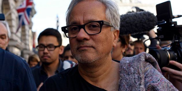 LONDON, ENGLAND - SEPTEMBER 17: Anish Kapoor walks through the city as part of a march in solidarity with migrants currently crossing Europe on September 17, 2015 in London, England. Each artist carried a single blanket symbolizing the needs that face migrants coming to Europe. (Photo by Ben Pruchnie/Getty Images)
