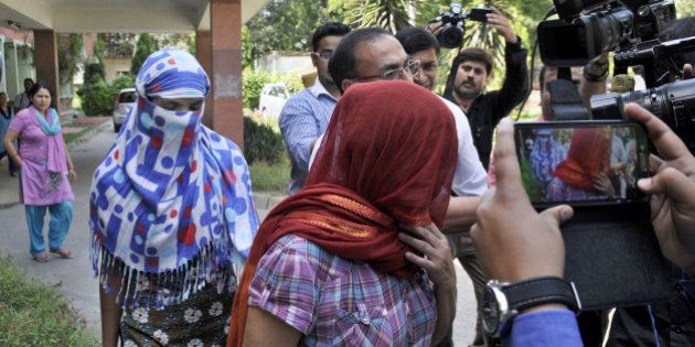 NEW DELHI, INDIA - SEPTEMBER 9: The two Nepalese women who were allegedly harassed by Saudi diplomat in Gurgaon, at Nepal embassy on September 9, 2015 in New Delhi, India. Two Nepalese maids have accused a Saudi diplomat of rape and torture while they were working in his home at Gurgaon on the outskirts of the national capital after which local police filed an FIR in the matter. The Nepal ambassador said that the Nepal embassy is in touch with the MEA and local police authorities sought detailed report on the incident. (Photo by Sushil Kumar/Hindustan Times via Getty Images)