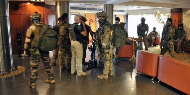 Members of special forces are seen inside the Radisson Blu hotel in Bamako on November 20, 2015, after the assault of security forces. Suspected Islamist gunmen stormed a luxury hotel in Mali's capital on November 20, firing automatic weapons and seizing more than 100 guests and staff in a hostage-taking that has left at least 22 people dead. AFP PHOTO / HABIBOU KOUYATE (Photo credit should read HABIBOU KOUYATE/AFP/Getty Images)