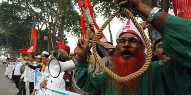 Bangladeshi secular activists and former fighters who fought in the 1971 war of independence against Pakistan protest as they call for the death penalty to be upheld for opposition leaders for Salauddin Quader Chowdhury and Ali Ahsan Mohammad Mujahid, over war crimes in that conflict, outside the Supreme Court in Dhaka on November 18, 2015. Bangladesh's highest court on November 18 upheld the death sentences of two opposition leaders convicted for atrocities during the 1971 independence war against Pakistan, sparking fears of violence by their supporters. AFP PHOTO (Photo credit should read STR/AFP/Getty Images)