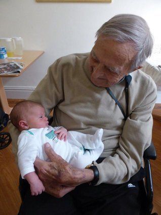 "This is a special family photo. My Dad aged 93, holding his great granddaughter, then 10 days old, for the first time. He was desperate to hold her. He died 2 weeks later."