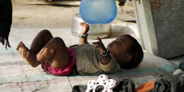 AJMER, INDIA - 2015/05/10: A baby playing balloon on the occasion of 'Mothers Day'. (Photo by Anand Sharma/Pacific Press/LightRocket via Getty Images)