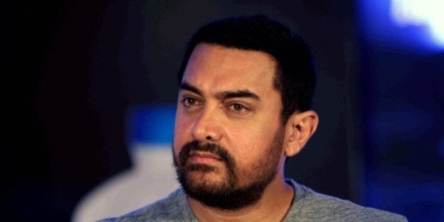 Indian Bollywood actor Aamir Khan looks on during a match at the Maharashtra Chess League (MCL) in Mumbai on May 23, 2015. AFP PHOTO / STR (Photo credit should read STRDEL/AFP/Getty Images)