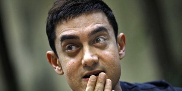 Bollywood actor Aamir Khan gestures during a press conference to promote his new film