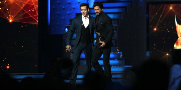 MUMBAI, INDIA -JANUARY 16: Bollywood actor Salman Khan and Shah Rukh Khan at the stage of Star Guild Awards in Mumbai.(Photo by Milind Shelte/India Today Group/Getty Images)