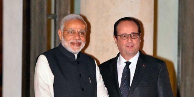 PARIS, FRANCE - APRIL 10: French President Francois Hollande (R) welcomes Indian Prime Minister Narendra Modi (L) ahead of an official dinner in his honor at the Elysee Palace in Paris, France on April 10, 2015. (Photo by Mustafa Yalcin/Anadolu Agency/Getty Images)