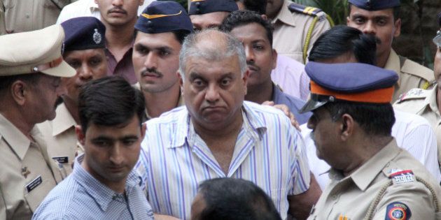 MUMBAI, INDIA - NOVEMBER 23: Peter Mukerjea, who was arrested in the Sheena Bora case, taken to Esplanade Court on November 23, 2015 in Mumbai, India. Court has increased the CBI custody of the 59-year-old former media magnate charged with murder and criminal conspiracy in the Sheena Bora murder case. In August, Mumbai Police arrested his wife Indrani, her ex-husband Sanjeev Khanna and her former driver Shyamwar Rai in connection with the murder. (Photo by Bhushan Koyande/Hindustan Times via Getty Images)