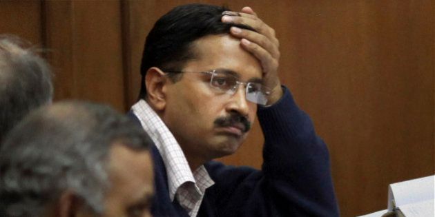 Anti-graft activist Arvind Kejriwal attends a session on Jan Lokpal, a strong legislation to end corruption, in the Delhi Assembly in New Delhi, India, Friday, Feb. 14, 2014. Kejriwal says he has resigned as the top elected official in the New Delhi state government after lawmakers blocked the introduction of a bill to create a strong ombudsman in the Indian capital. (AP Photo)