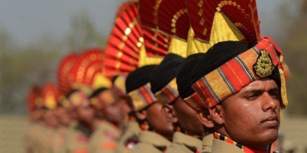Indian Border Security Force (BSF) recruits take part in a passing out parade in Humhama on the outskirts of Srinagar on October 3, 2015. Some 338 new recruits were inducted into the force. Several groups have for decades battled hundreds of thousands of Indian troops deployed in the region, for independence or a merger of the territory with Pakistan. The conflict has left tens of thousands, mostly civilians, dead. AFP PHOTO/Tauseef MUSTAFA (Photo credit should read TAUSEEF MUSTAFA/AFP/Getty Images)