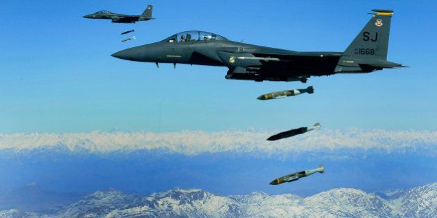 U.S. Air Force F-15E Strike Eagles, from the 335th Expeditionary Fighter Squadron, drop 2,000 pound Joint Direct Attack Munitions on a cave in eastern Afghanistan, Nov. 26, 2009. The 335th is deployed to Bagram Airfield, Afghanistan, from Seymour Johnson Air Force Base, N.C. (U.S. Air Force photo by Staff Sgt. Michael B. Keller) (Released)