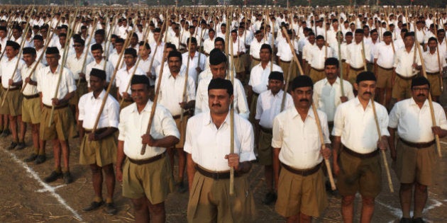 Volunteers of the militant Hindu group Rashtriya Swayamsevak Sangh (RSS) participate in a three-day workers camp on the outskirts of Ahmadabad, India, Saturday, Jan. 3, 2015. The RSS, parent organization of the ruling Bharatiya Janata Party, combines religious education with self-defense exercises. The organization has long been accused of stoking religious hatred against Muslims. (AP Photo/Ajit Solanki)